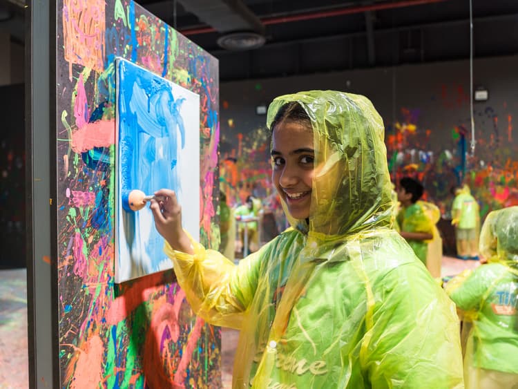 Girl smiling at spin painting party