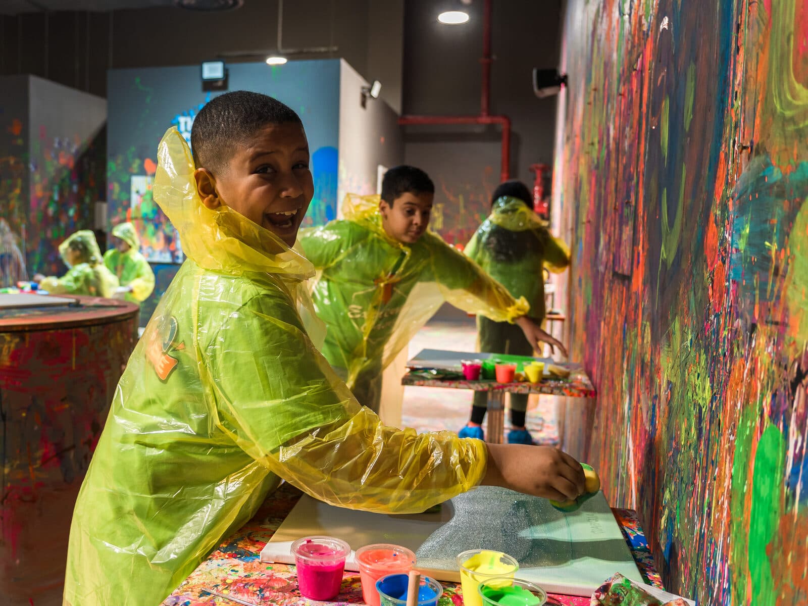 Happy kids celebrating at a birthday paint party